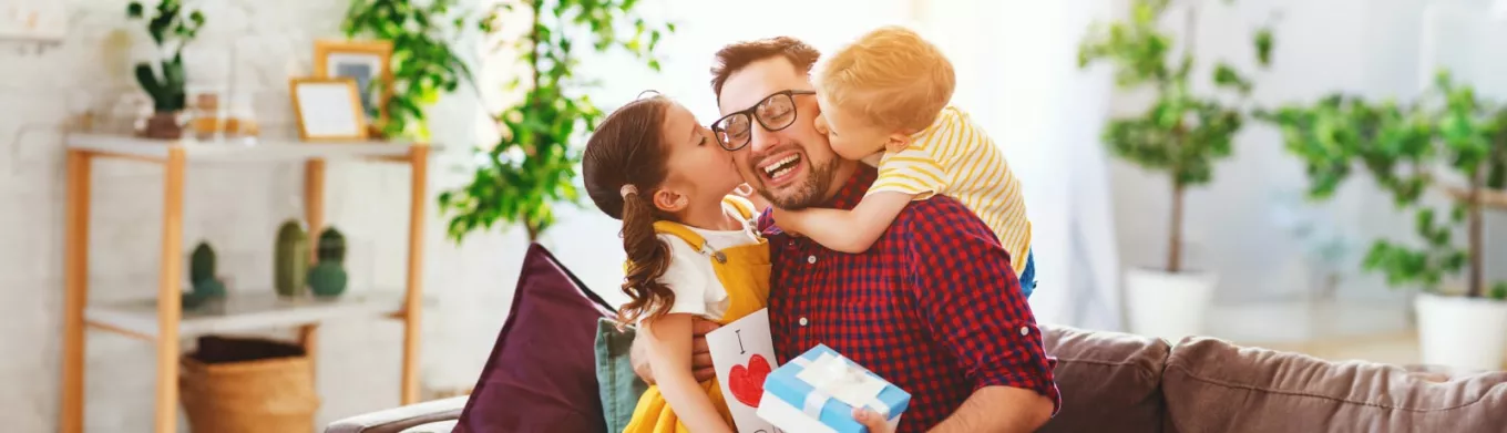 Father with his girls receiving gifts 