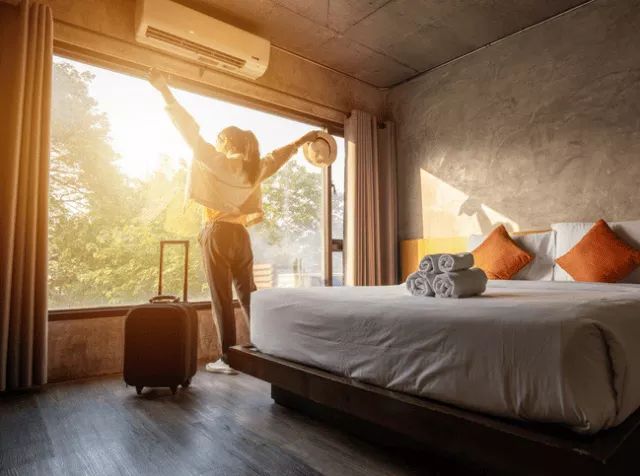 Girl in a Hotel room with a suitcase