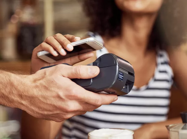 Woman paying with mobile