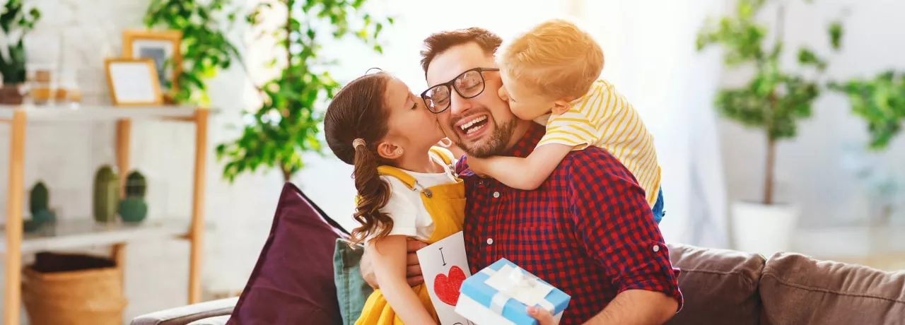 Father with his girls receiving gifts