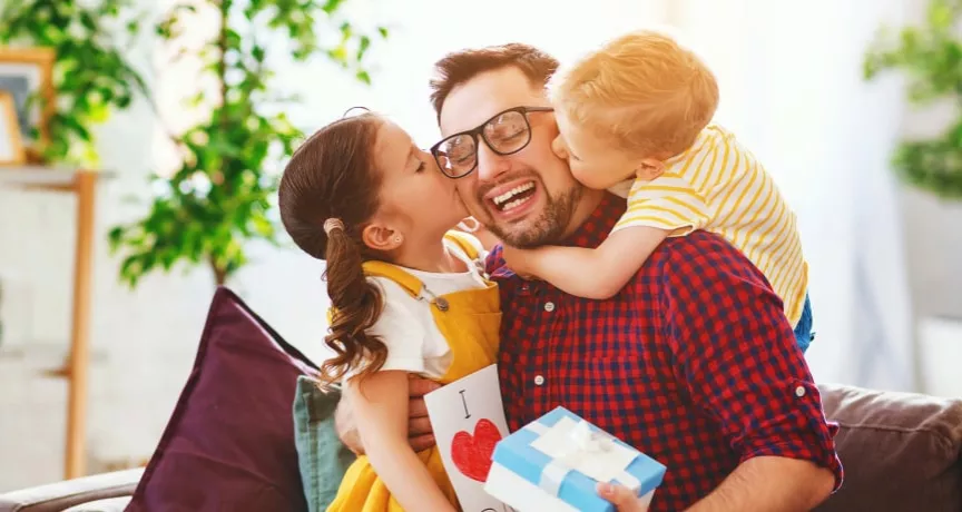 Father with his girls receiving gifts