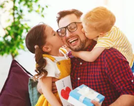 Father with his girls receiving gifts