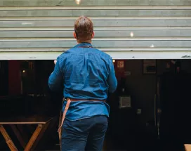 Man closing a shop