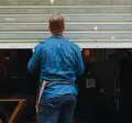 Man closing a shop