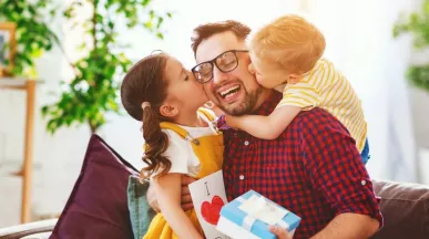 Father with his girls receiving gifts