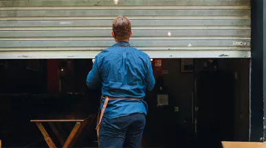 Man closing a shop