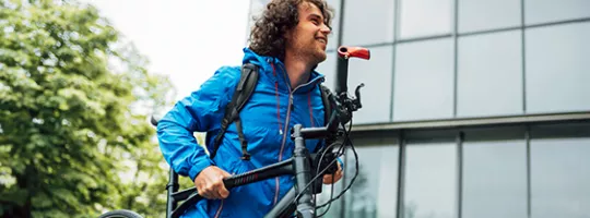Man carrying a bike 