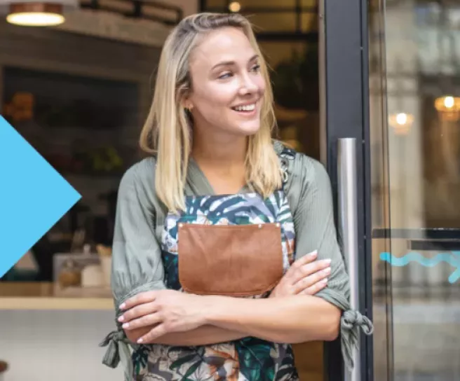 Merchant in front of her shop