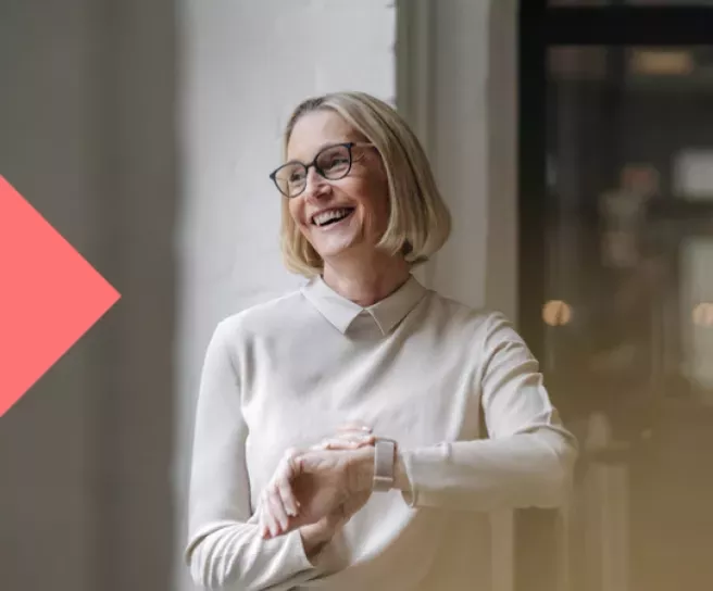 Women laughing using her smartwatch
