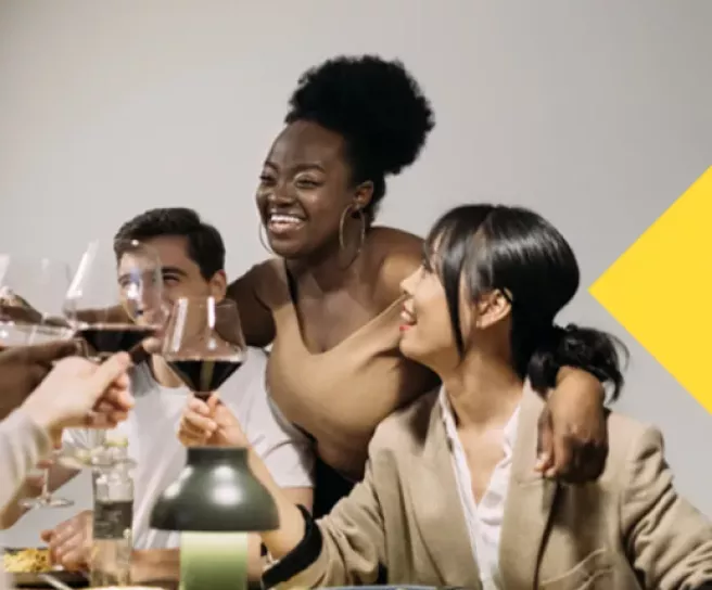 Friends laughing around the table